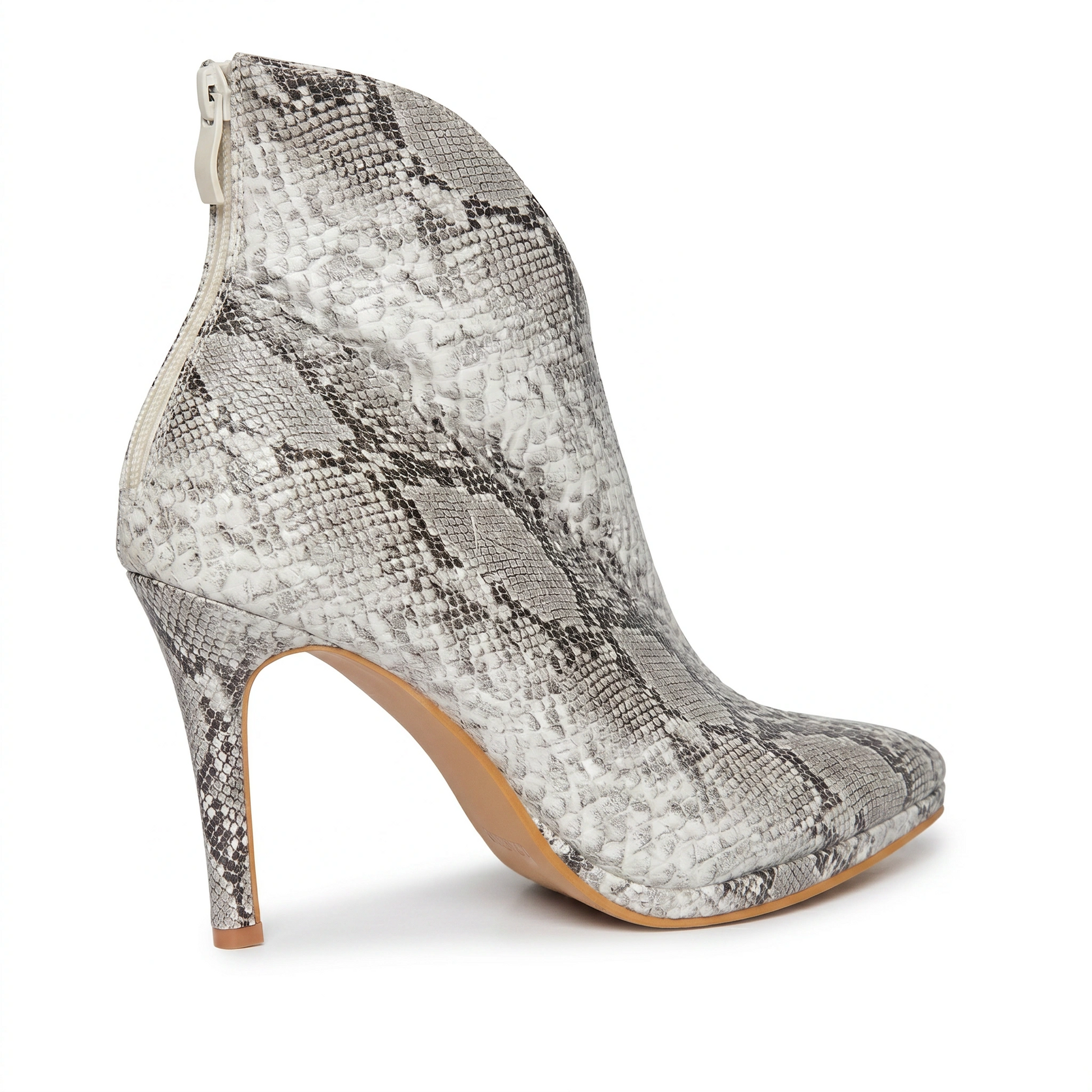 High-heeled shoe with snake print on a white background