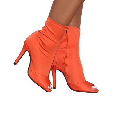 Faith vibrant orange open-toe ankle boots with stiletto heels and side zipper, sleek and stylish women’s footwear.