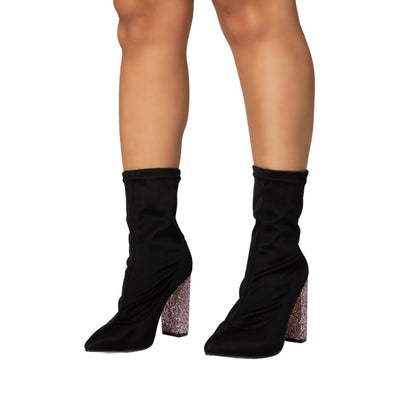 Dream black stretch fabric ankle boots with pointed toe and glitter block heels on model legs
